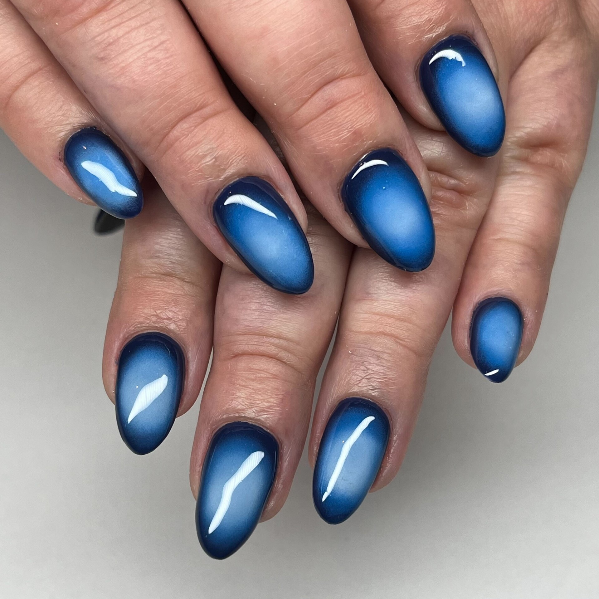 Blue aura ombre almond nails