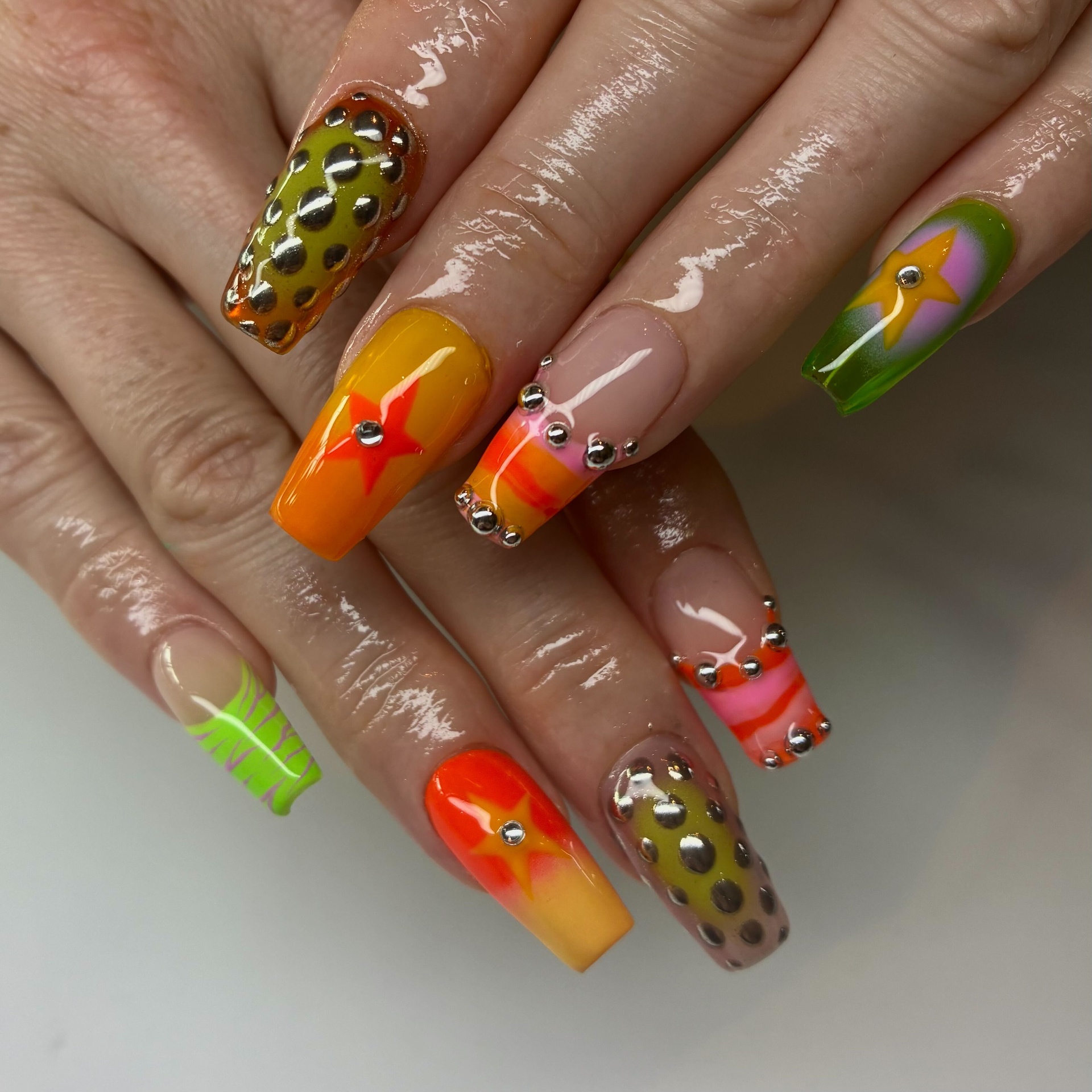 Neon coffin nails with studs and stars